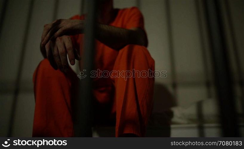 Low angle view of an inmate smoking in prison