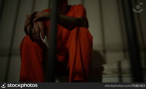 Low angle view of an inmate smoking in prison