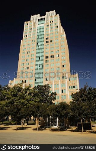 Low angle view of an office building at a road side