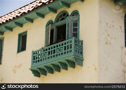 Low angle view of an ornate turquoise balcony