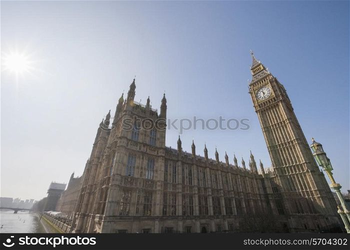 Low angle view of Big Ben and parliament building against clear sky at London; England; UK