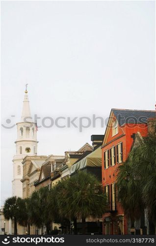 Low angle view of buildings and a church, St. John&acute;s Lutheran Church, Charleston, South Carolina, USA