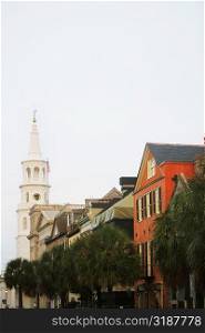 Low angle view of buildings and a church, St. John&acute;s Lutheran Church, Charleston, South Carolina, USA