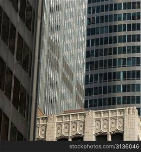 Low angle view of buildings in a city, Monroe Street, Chicago, Cook County, Illinois, USA