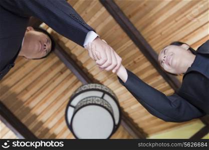 Low Angle View of Businesspeople Shaking Hands