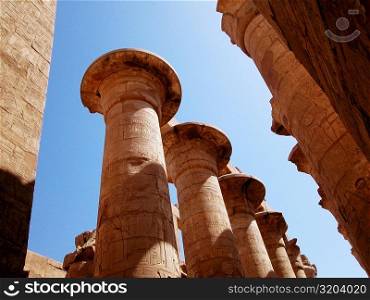 Low angle view of carved columns of a temple, Temples Of Karnak, Luxor, Egypt