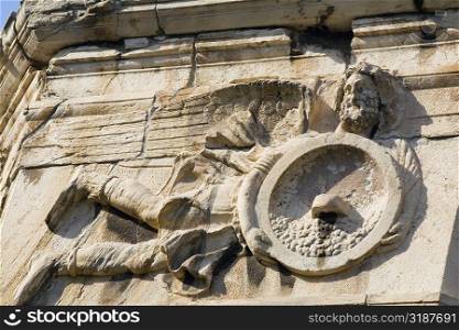 Low angle view of carving on a tower, Tower Of The Winds, Roman Agora, Athens, Greece