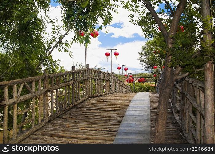 Low angle view of Chinese lanterns hanging along a boardwalk, HohHot, Inner Mongolia, China
