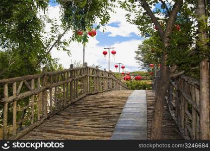 Low angle view of Chinese lanterns hanging along a boardwalk, HohHot, Inner Mongolia, China