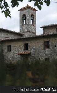 Low angle view of church bell tower, Badiaccia a Montemuro, Radda in Chianti, Tuscany, Italy