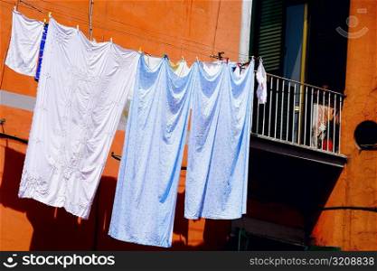 Low angle view of clothes hanging on a clothesline, Naples, Naples Province, Campania, Italy