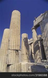Low angle view of columns at an old ruin, Parthenon, Athens, Greece