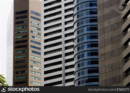 Low angle view of commercial buildings, Singapore