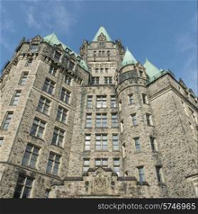 Low angle view of Confederation Building and Peace Tower, Parliament Hill, Ottawa, Ontario, Canada
