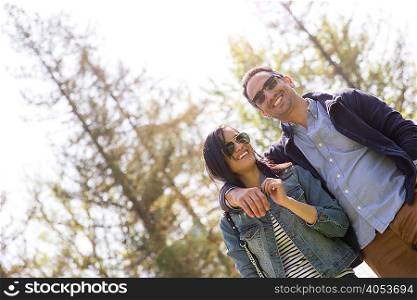 Low angle view of couple wearing sunglasses