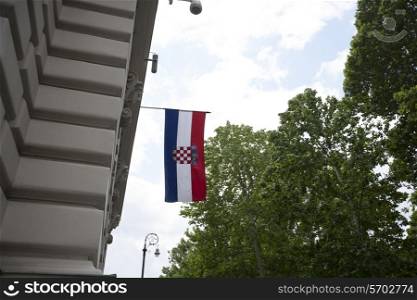 Low angle view of Croatian flag hanging on parliament building, Zagreb, Croatia