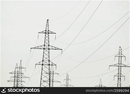 Low angle view of electricity pylons