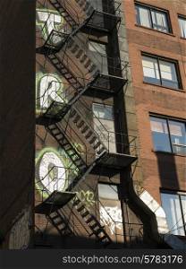 Low angle view of fire escape of a building at Golden Square Mile, Montreal, Quebec, Canada