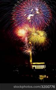 Low angle view of fire works display at night, Lincoln Memorial, Washington Monument, Washington DC, USA