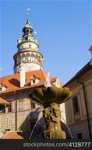 Low angle view of fountain in front of a tower, Czech Republic