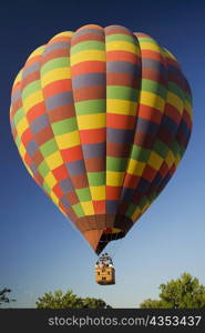 Low angle view of hot air balloon flying in the sky