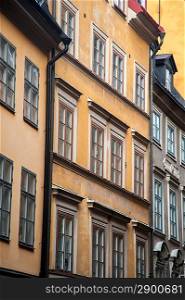 Low angle view of houses in Tyska Brinken, Gamla Stan, Stockholm, Sweden