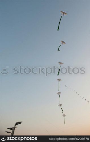 Low angle view of kites in the sky, Olympic Green, Beijing, China