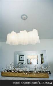 Low angle view of lamp shades over a dining table