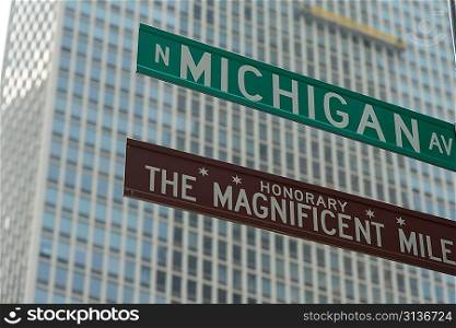 Low angle view of Magnificent Mile, Michigan Avenue signs, Chicago, Cook County, Illinois, USA