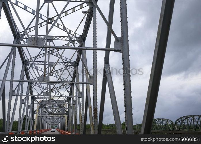 Low angle view of metallic bridge against sky, Derby Junction, New Brunswick, Canada