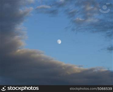 Low angle view of moon and clouds in sky, Lake of The Woods, Ontario, Canada