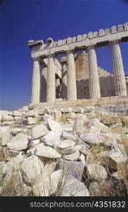 Low angle view of old ruin colonnades, Parthenon, Athens, Greece