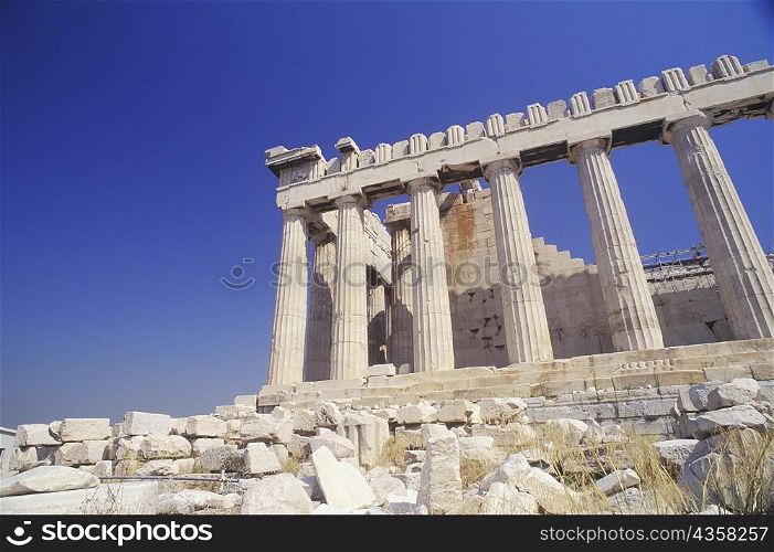 Low angle view of old ruin colonnades, Parthenon, Athens, Greece