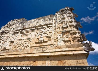 Low angle view of old ruins of a building, Cuadrangulo De los Pajaros, Uxmal, Yucatan, Mexico