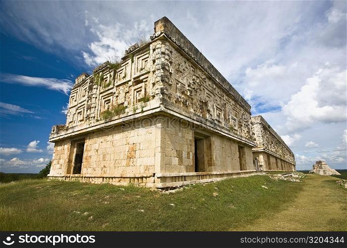 Low angle view of old ruins of a palace, Palacio Del Gobernador, Uxmal, Yucatan, Mexico