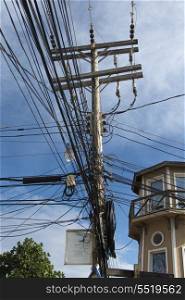 Low angle view of power cables, Utila Island, Bay Islands, Honduras
