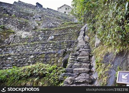 Low angle view of ruined steps, Aguas Calientes, Mt Huayna Picchu, Machu Picchu, Cusco Region, Peru