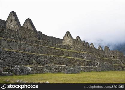 Low angle view of ruins on mountains, Machu Picchu, Cusco Region, Peru