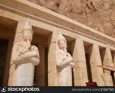 Low angle view of sculpture engraved on the columns of a building, Egypt