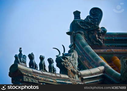 Low angle view of sculpture on the roof of a building, Tower of Buddha Fragrance, Summer Palace, Beijing, China