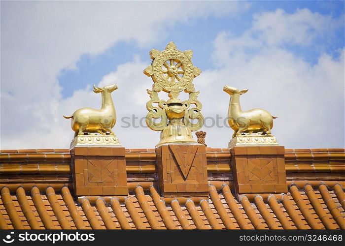 Low angle view of sculptures on the roof of a temple, Da Zhao Temple, Hohhot, Inner Mongolia, China