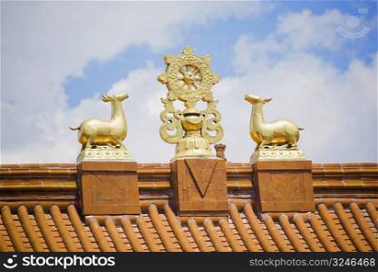 Low angle view of sculptures on the roof of a temple, Da Zhao Temple, Hohhot, Inner Mongolia, China
