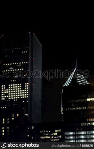 Low angle view of skyscrapers at night, Chicago, Illinois, USA