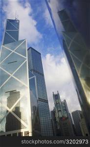 Low angle view of skyscrapers in a city, Hong Kong, China