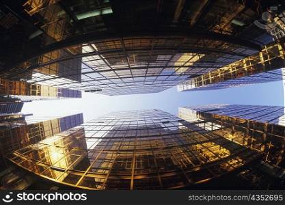 Low angle view of skyscrapers in a city, Hong Kong, China