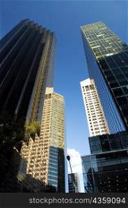 Low angle view of skyscrapers in a city, New York City, New York State, USA