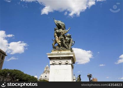 Low angle view of statues on the pedestal, Rome, Italy