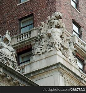 Low angle view of statues on the wall of a building, Chicago, Cook County, Illinois, USA
