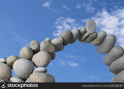 Low angle view of stones arranged in an arch shape