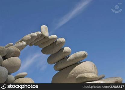 Low angle view of stones arranged in an arch shape